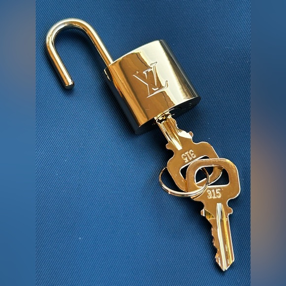 Louis Vuitton Handbags - Authentic Louis Vuitton padlock & 2 key set in gorgeous condition.